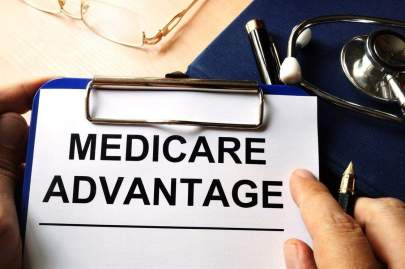 A clipboard holding a document with heading Medicare Advantage